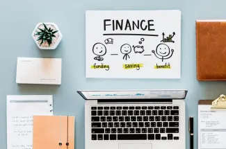 Finance concept displayed on a laptop screen, featuring graphs and charts related to financial analysis and planning.